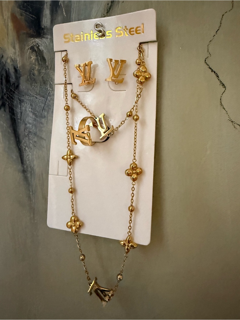 Gold Stainless Steel set 4 pcs , Necklace ,Earring, ring, bracelet .